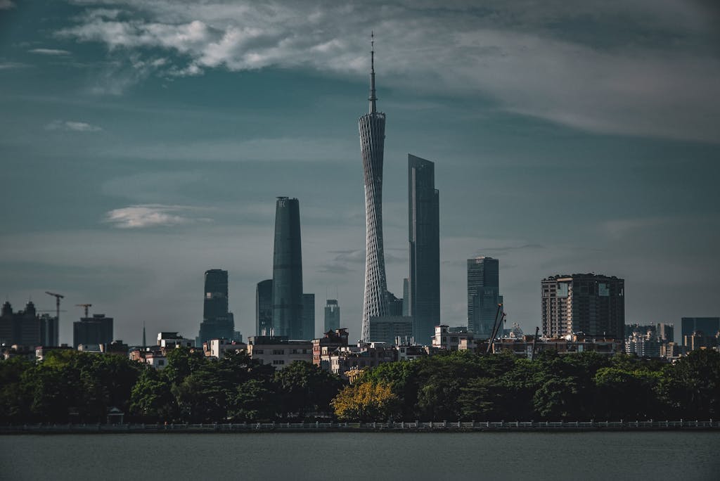 Majestic Guangzhou skyline featuring Canton Tower at twilight, reflecting cityscape elegance and modern architecture.